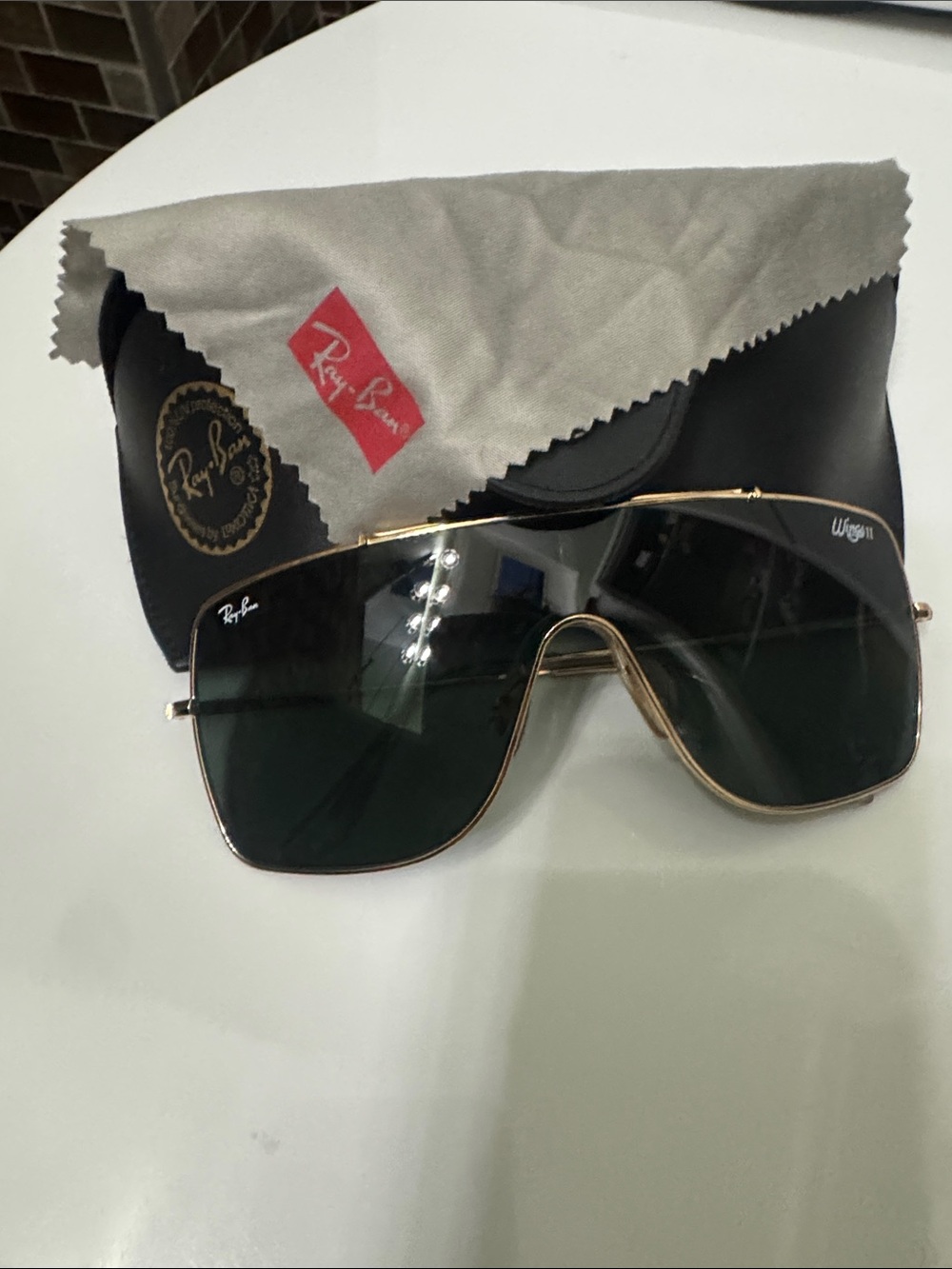 Ray-Ban Gold Frame Sunglasses with black Lenses